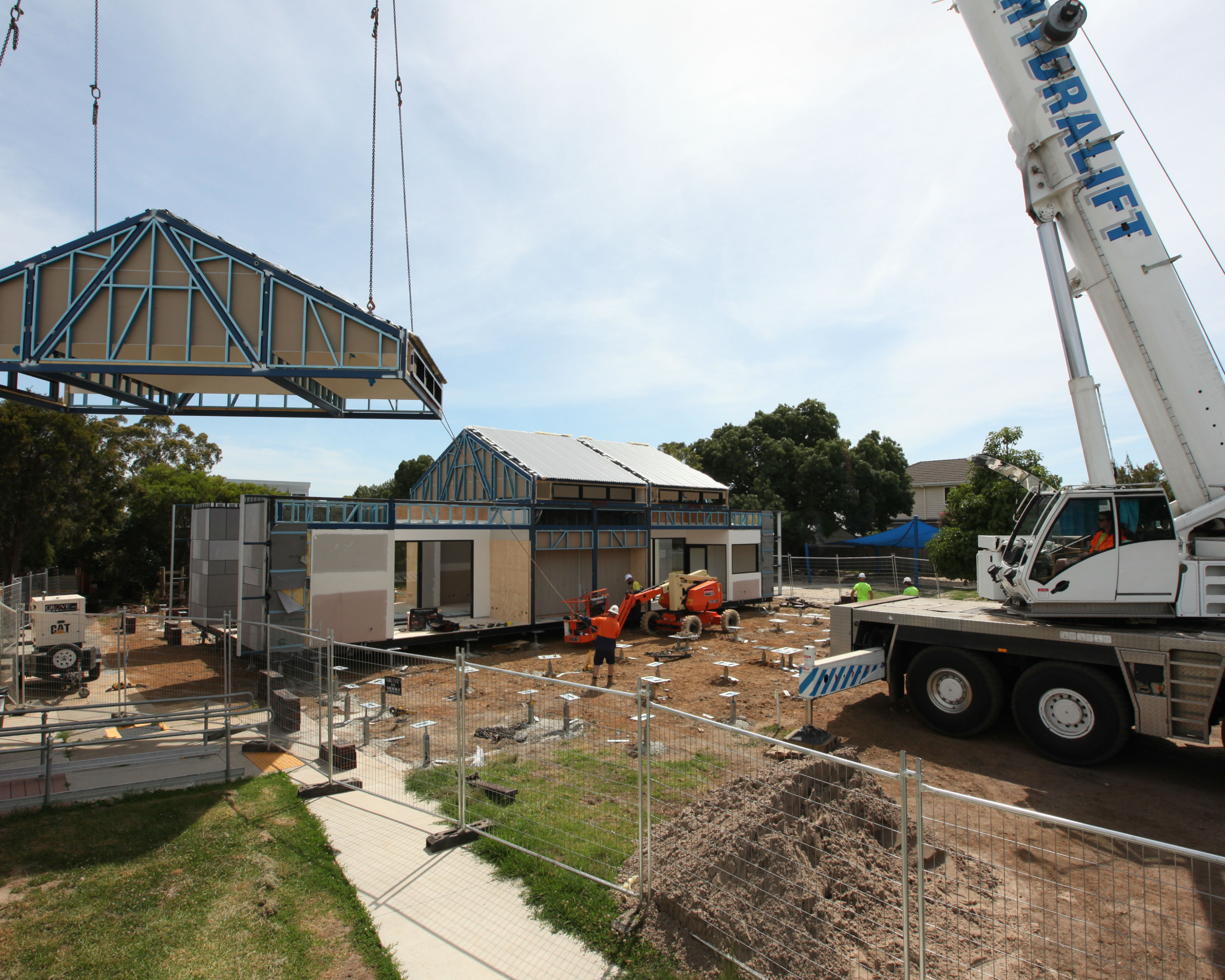 Crane Lifts Roof Onto Modular School